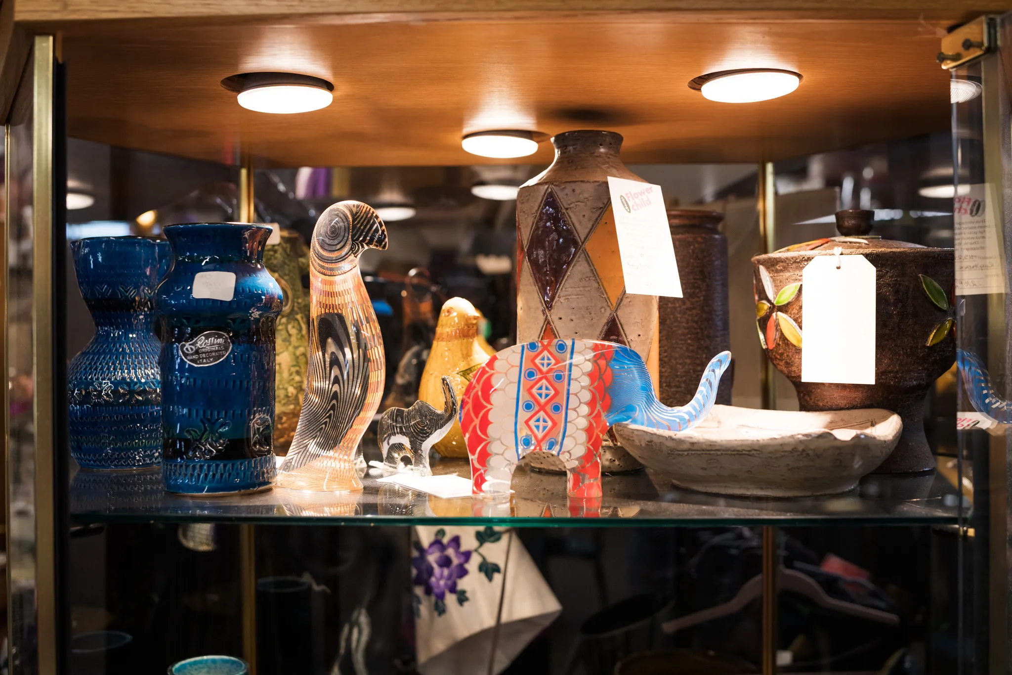 Colorful glass and ceramic art display case.