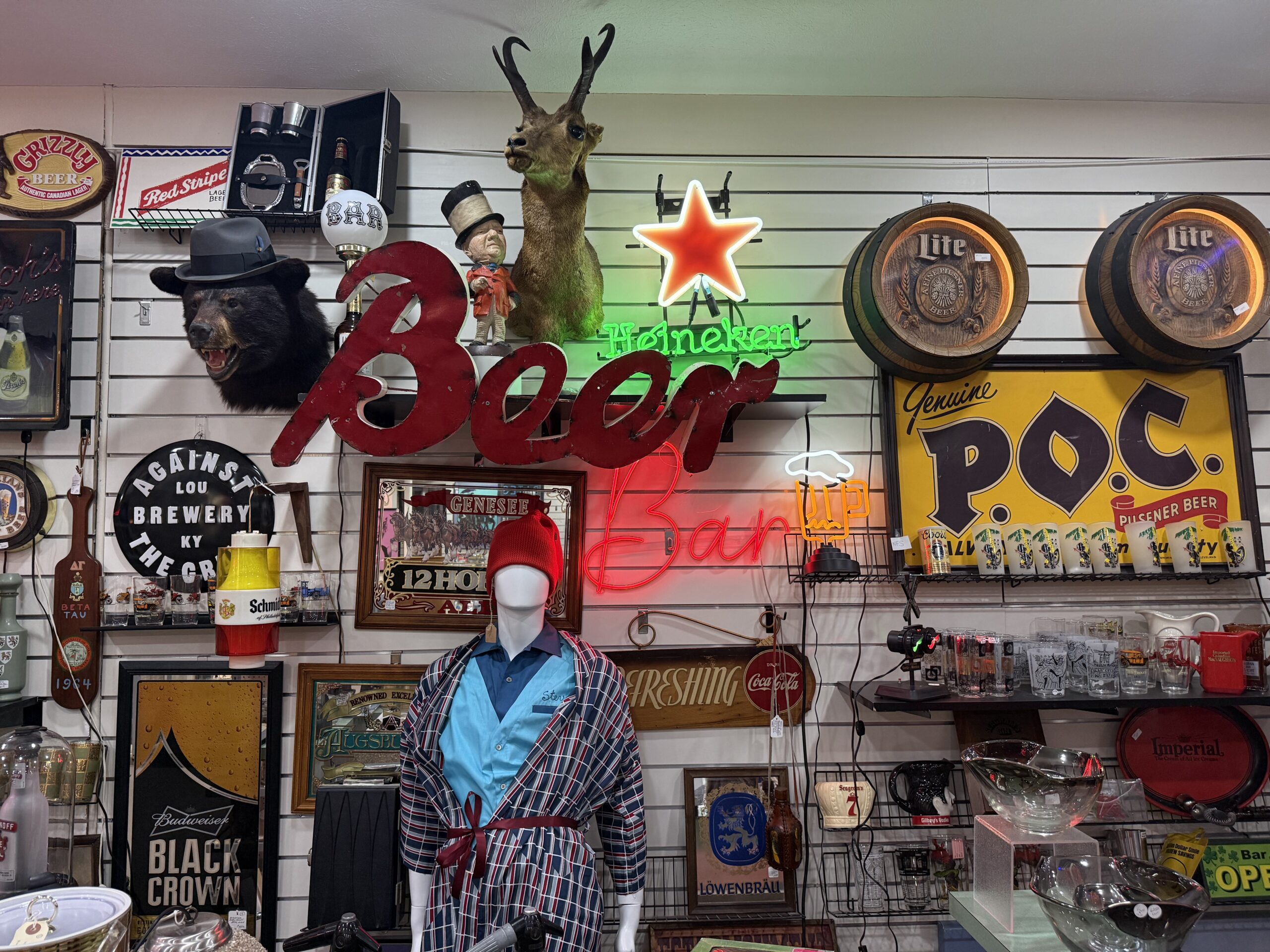 Vintage bar decor with neon beer signs.