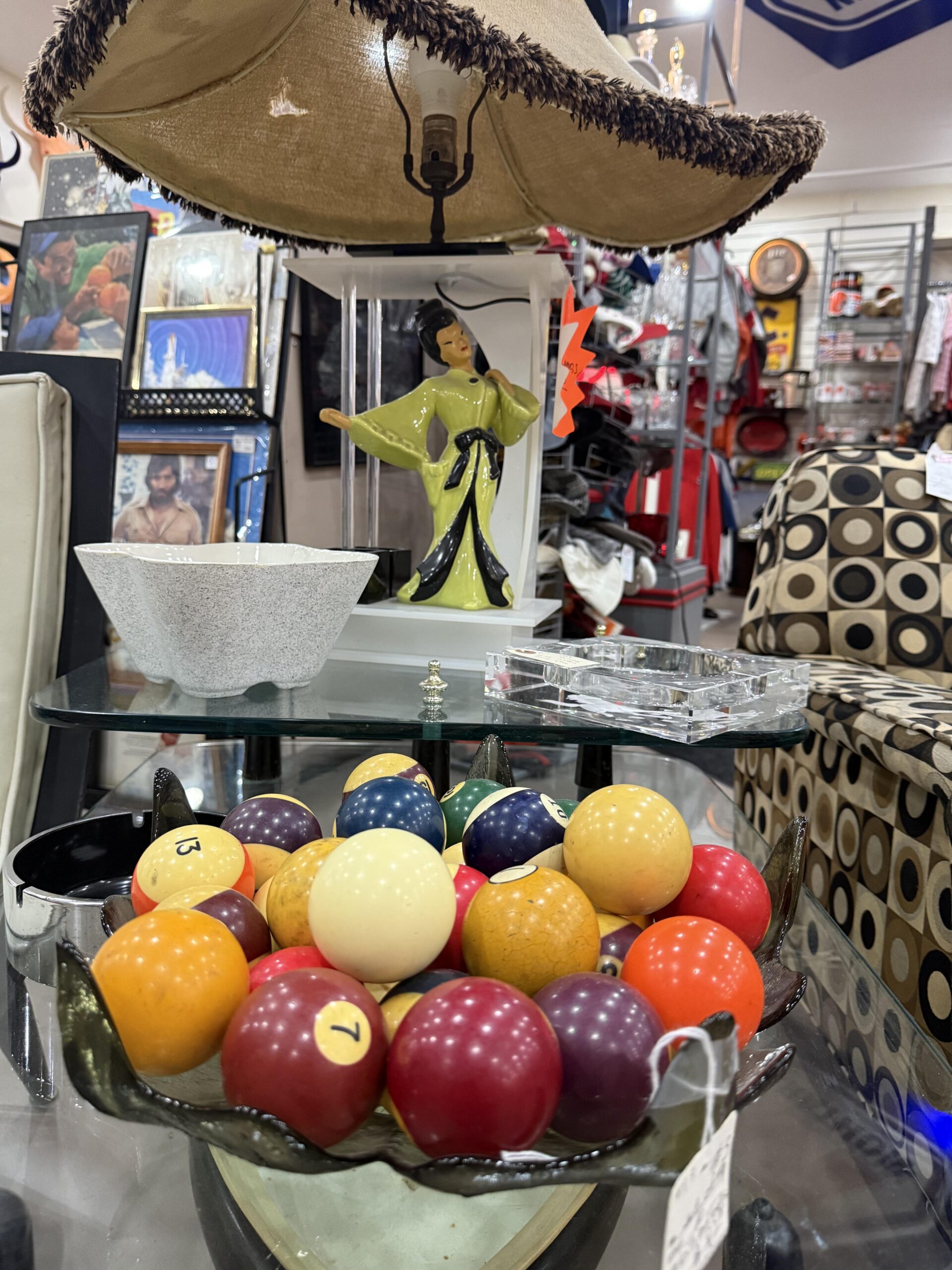 Decorative items displayed in a thrift store.