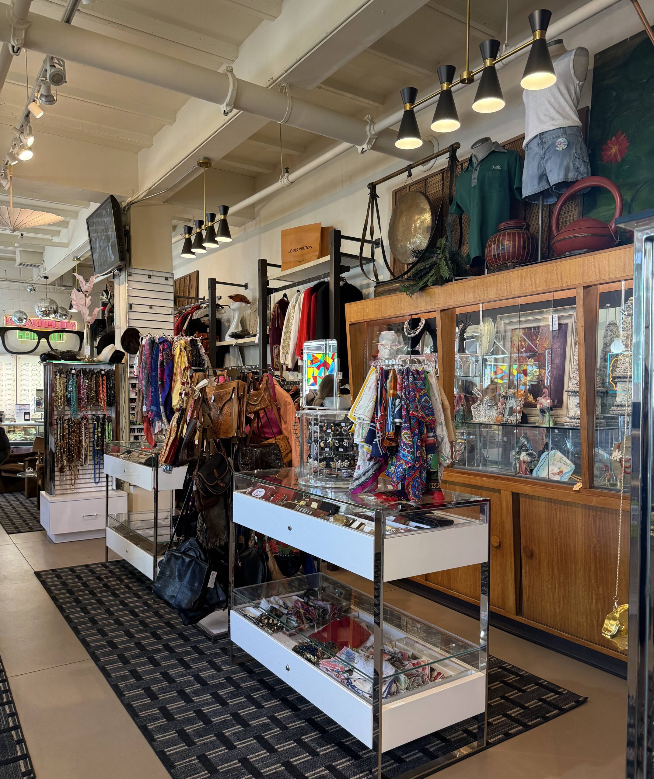 Vintage clothing store with colorful accessories display.