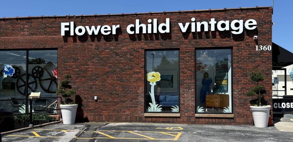 Brick storefront of Flower Child Vintage shop.